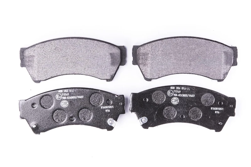HELLA 8DB 355 013-761 Brake pad set - with acoustic wear warning - T1749 - for e.g. LINCOLN / MAZDA - Image 1