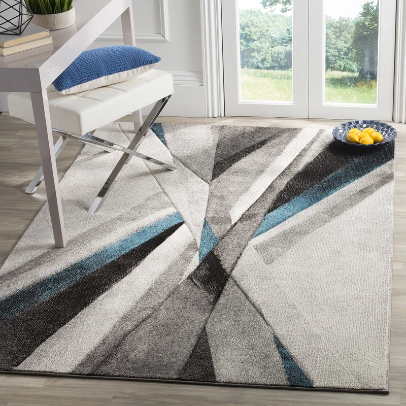 Safavieh Modern Graphic Indoor Woven Rectangle Area Rug, Hollywood Collection, HLW710, in Grey/Teal, 160 X 229 cm for Living Room, Bedroom or Any Indoor Space