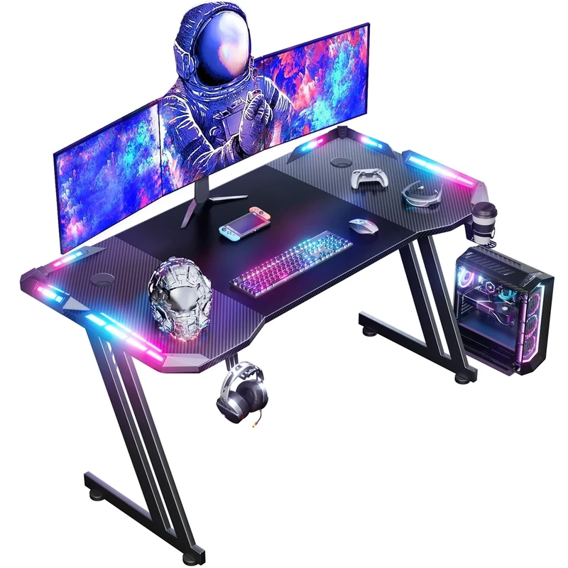 DLONGONE 140 x 60 cm RGB Gaming Desk, Gaming Table for Laptop, Home Office Desk with Carbon Fiber Coated, Gaming PC Table with Headphone Hook and Cup Holder, Easy to Assemble, Black