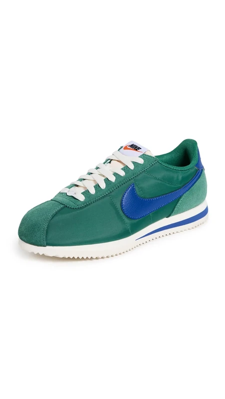 NIKE Women's Cortez Sneaker, Evergreen Aura Hyper Royal Sail White, 2.5 UK
