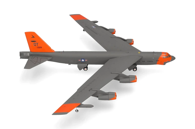 Herpa airplane model U.S. Air Force Boeing B-52H Stratofortress - 49th Test and Evaluation Sqn - "Test orange" livery on a scale of 1:200, metal miniature with pedastal, collectors edition