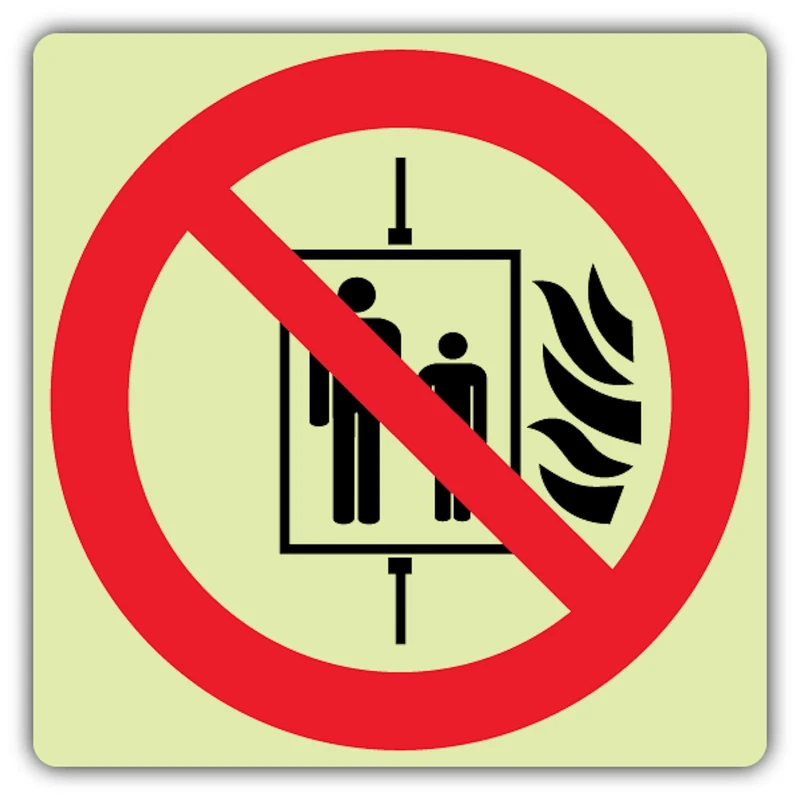 V Safety Glow In The Dark In The Event Of Fire Do Not Use This Lift Symbol Sign - Symbol Format - 450 x 450 mm - Made From Triple Glow Rigid Plastic - Fire Safety Signage - Made in Britain